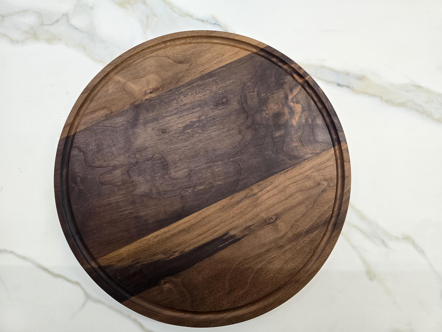 Round black walnut cutting board
