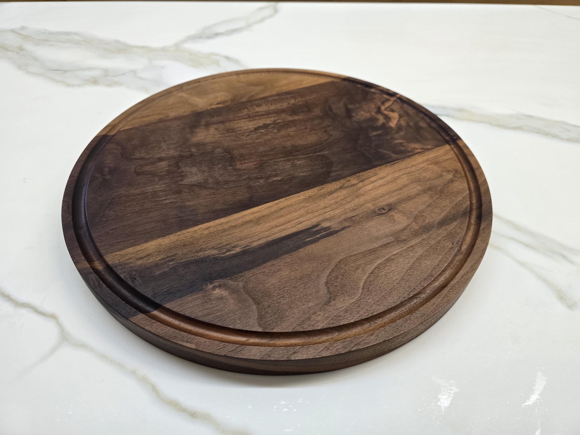 Round black walnut cutting board