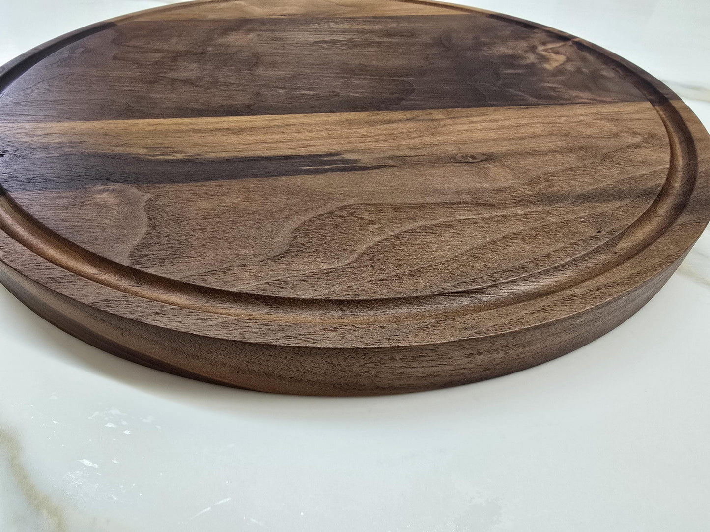 Round black walnut cutting board
