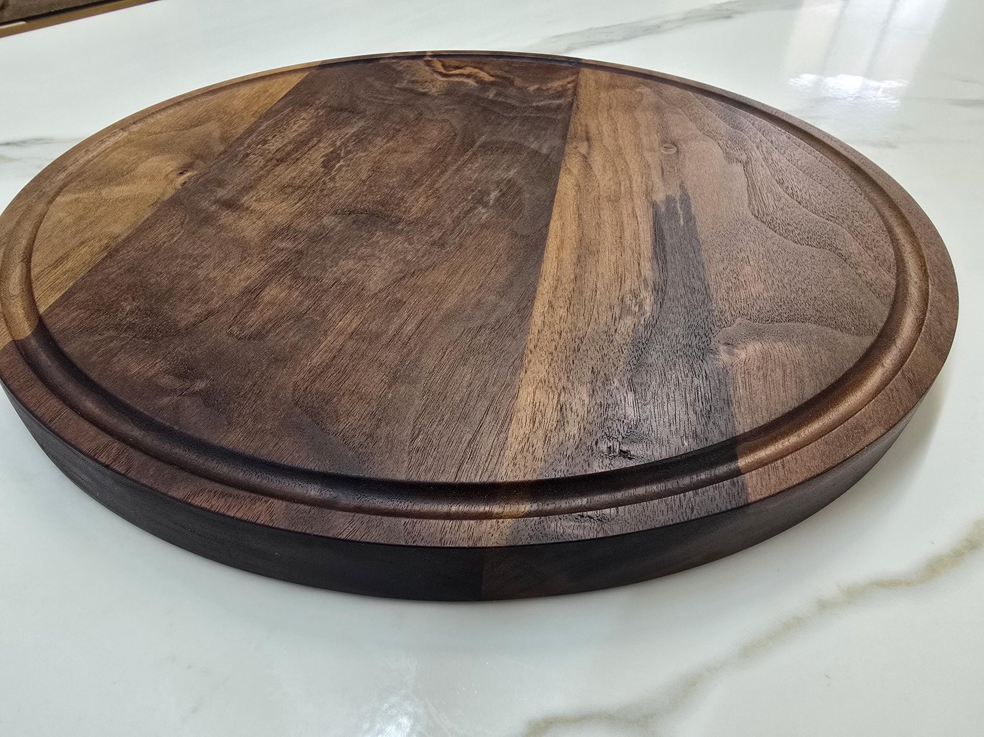 Round black walnut cutting board