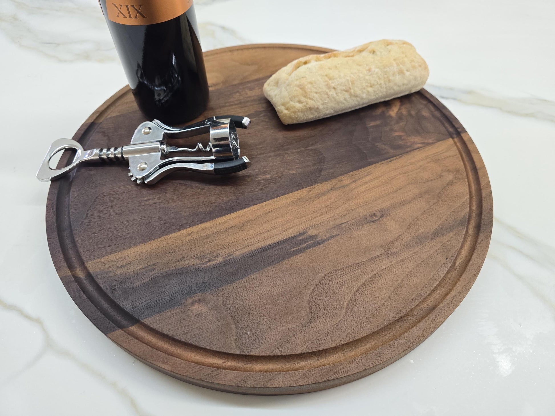 Round black walnut cutting board
